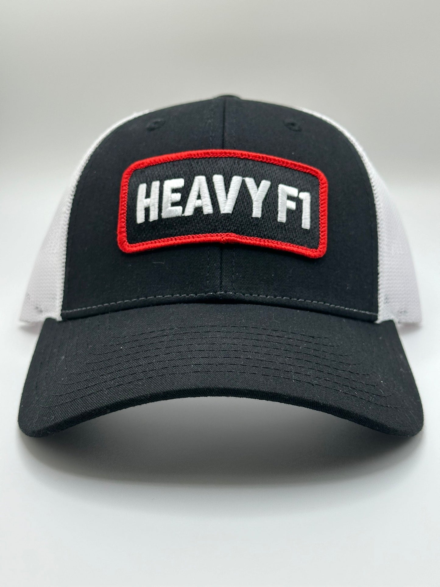 X Series: HEAVY F1 Trucker Hat